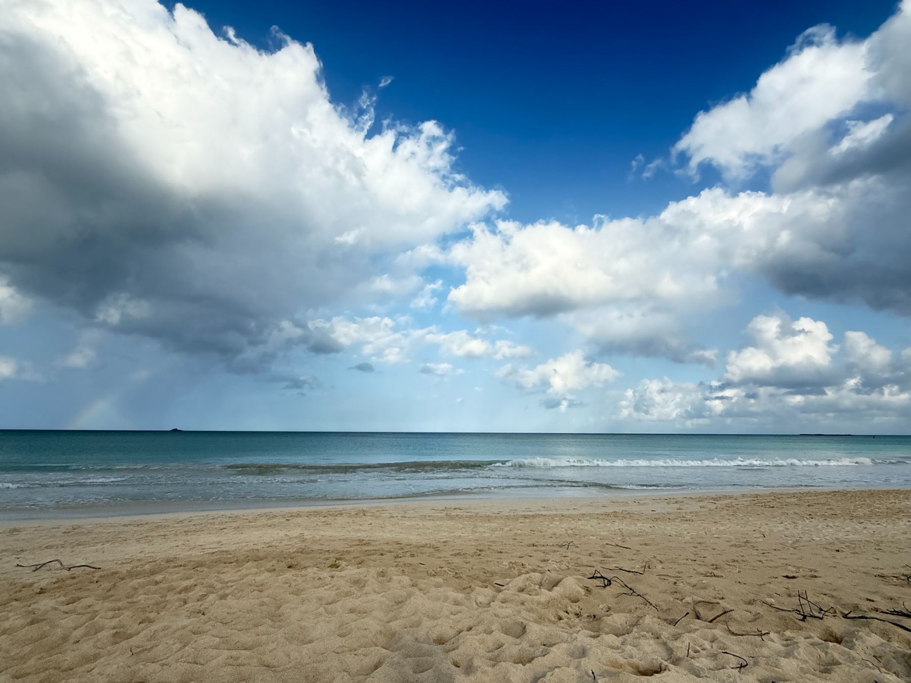 A long, open beach under a wide sky